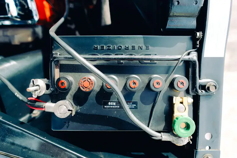 Car battery terminals and cables under the hood
