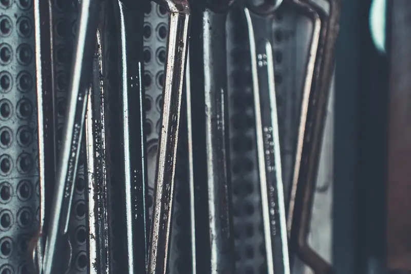 Combination wrenches hanging on a workshop wall